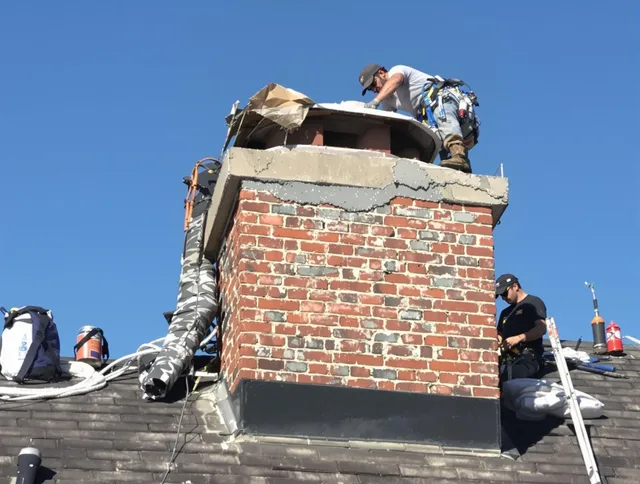 Florence-Graham Chimney Sweep installing a custom chimney crown in Florence-Graham, CA
