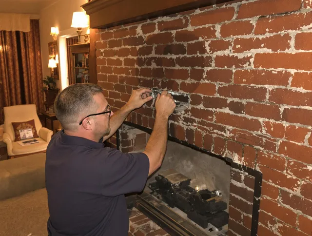 Florence-Graham Chimney Sweep expert fixing a fireplace in Florence-Graham, CA